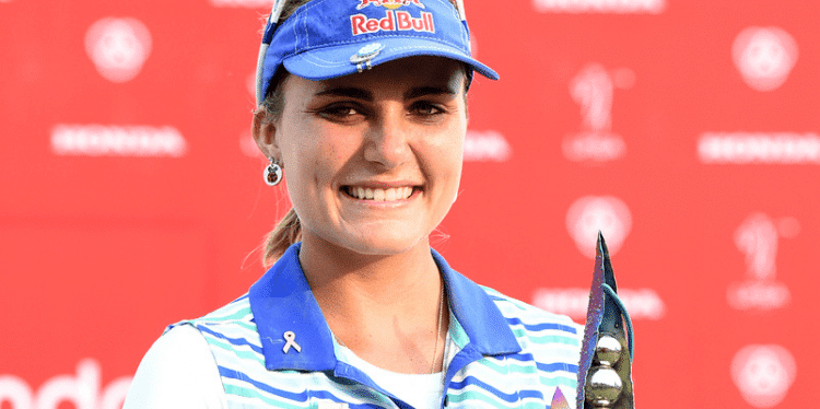 Young Coral Springs golf star Lexi Thompson holding a trophy
