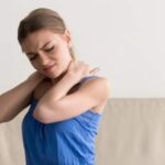 woman debating whiplash chiropractor or physical therapy for her pain