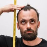 mean measuring his height using measuring tape