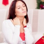woman having back pain during the holiday season
