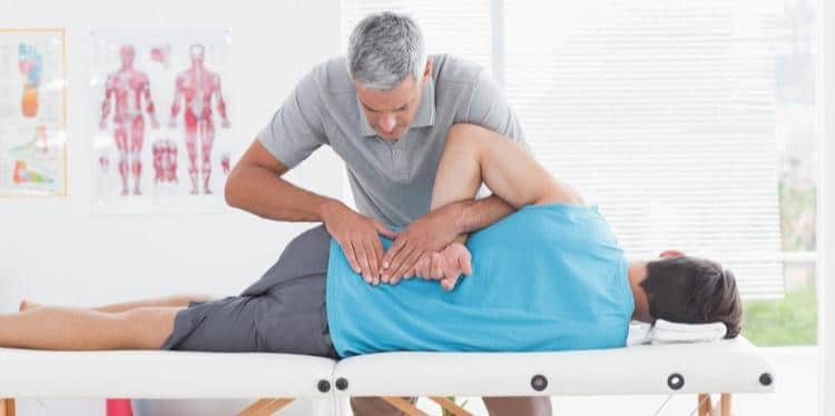 Man receiving chiropractic treatment.