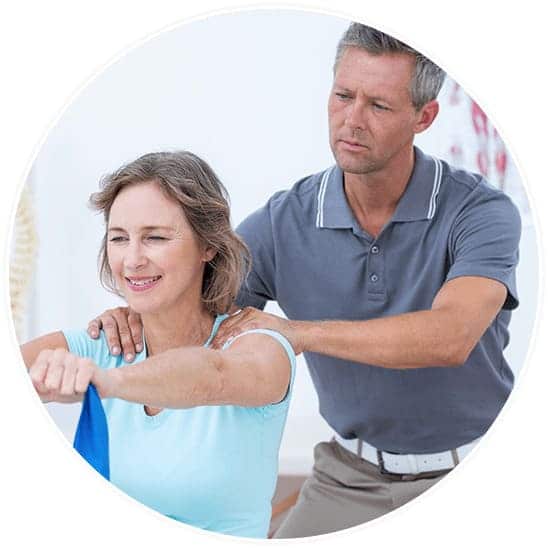 Chiropractor giving elder woman chiropractic care