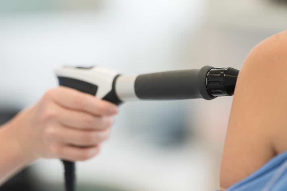 Close up of shockwave therapy on a patient