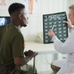 Patient discussing with a chiropractor.