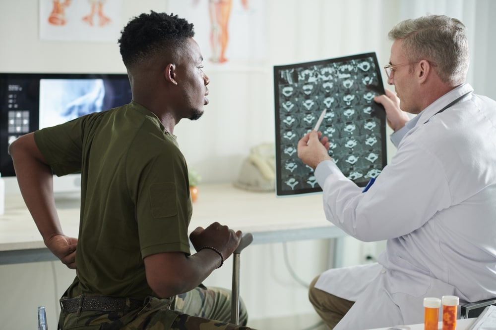 Patient discussing with a chiropractor.